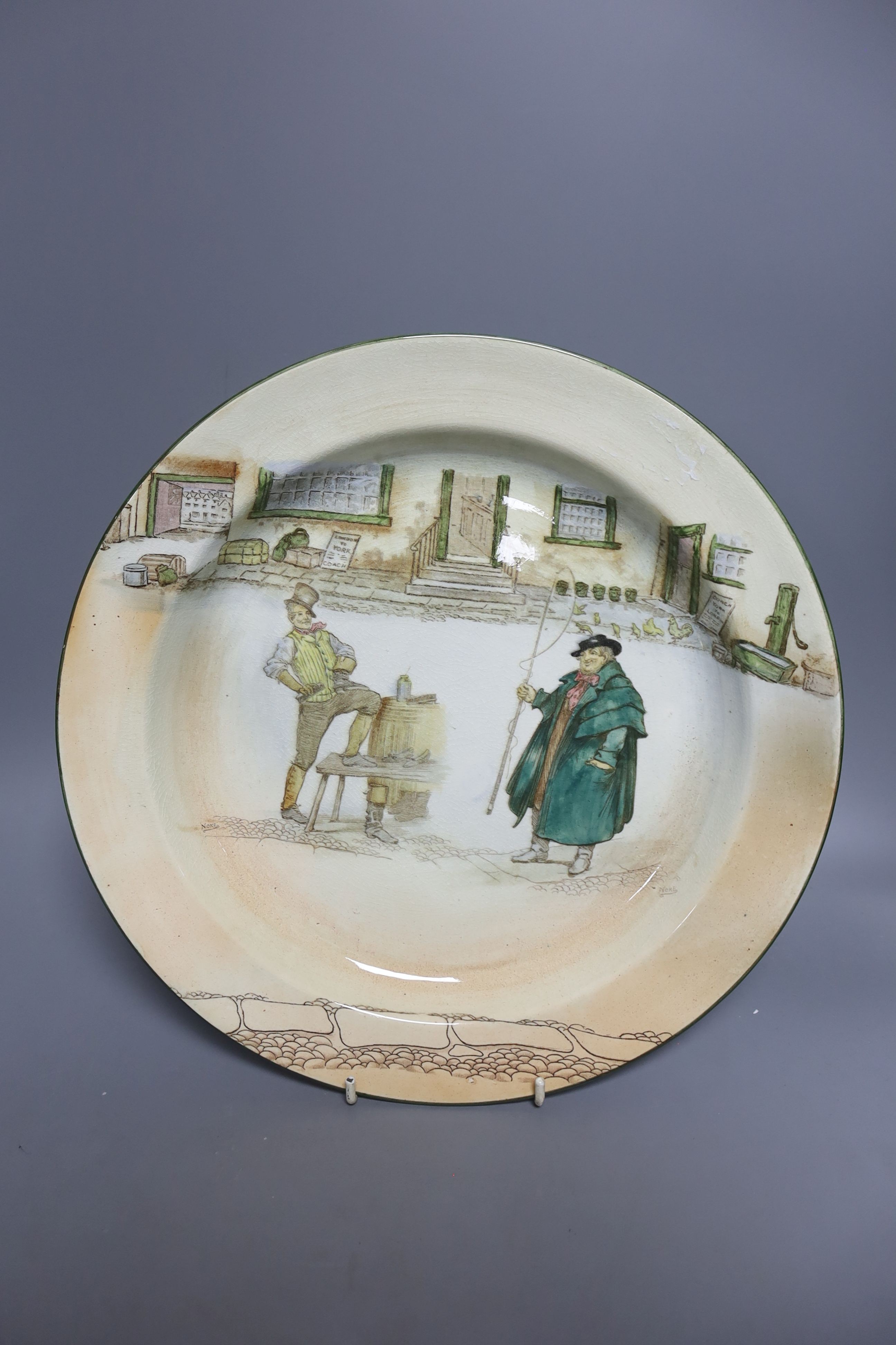 An Aynsley cabinet plate, painted with fruit, signed B.Jones, 26cm and a Royal Doulton Dickens ware dish, 32.5cm